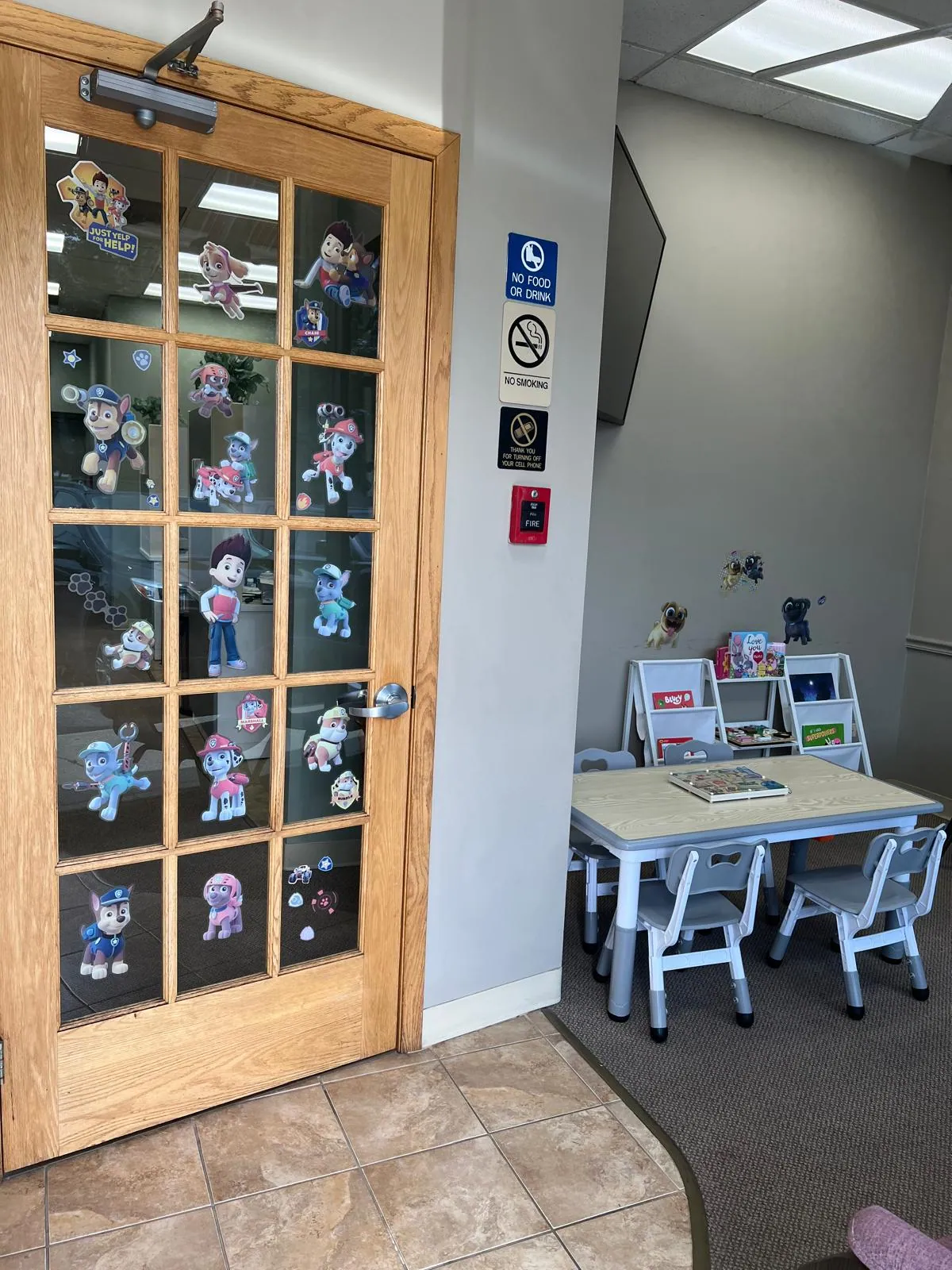 Children's waiting area with books and an activity table at Urban Dental Care